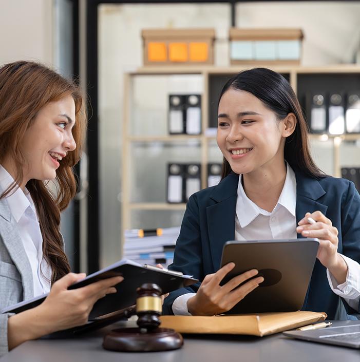 Two paralegals working in law office